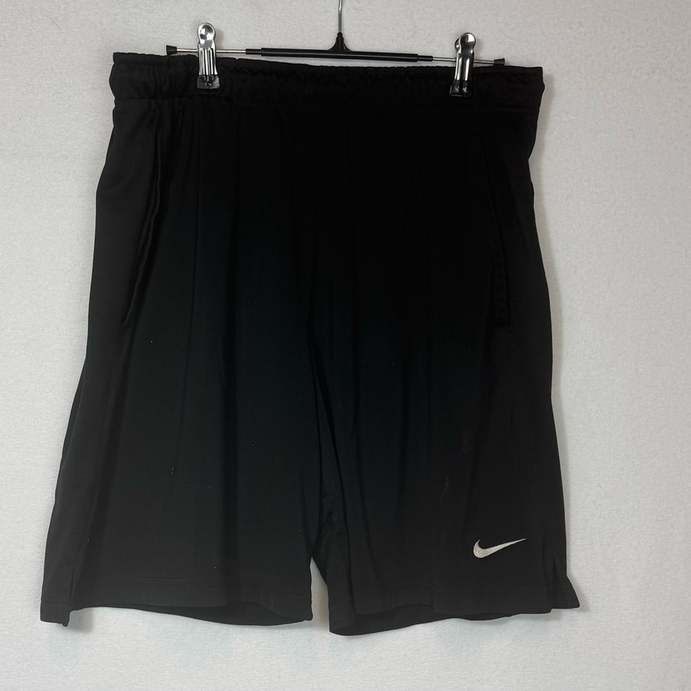 Black Nike Dri-Fit shorts with elastic waistband and drawstring